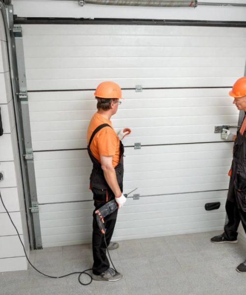 mid_workers-are-installing-lift-gates-garage890217814